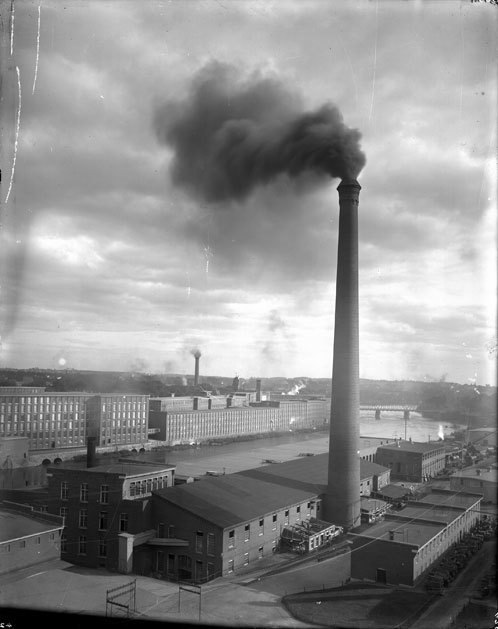 A heavily polluted Merrimack River runs through the Amoskeag Manufacturing Company in Manchester, New Hampshire in the 1800s.