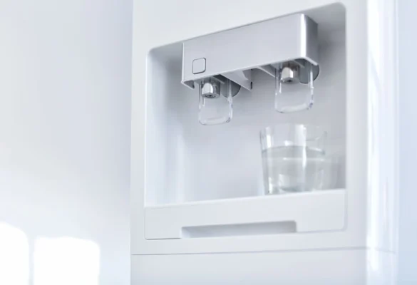 water dispensing from a refrigerator into a glass