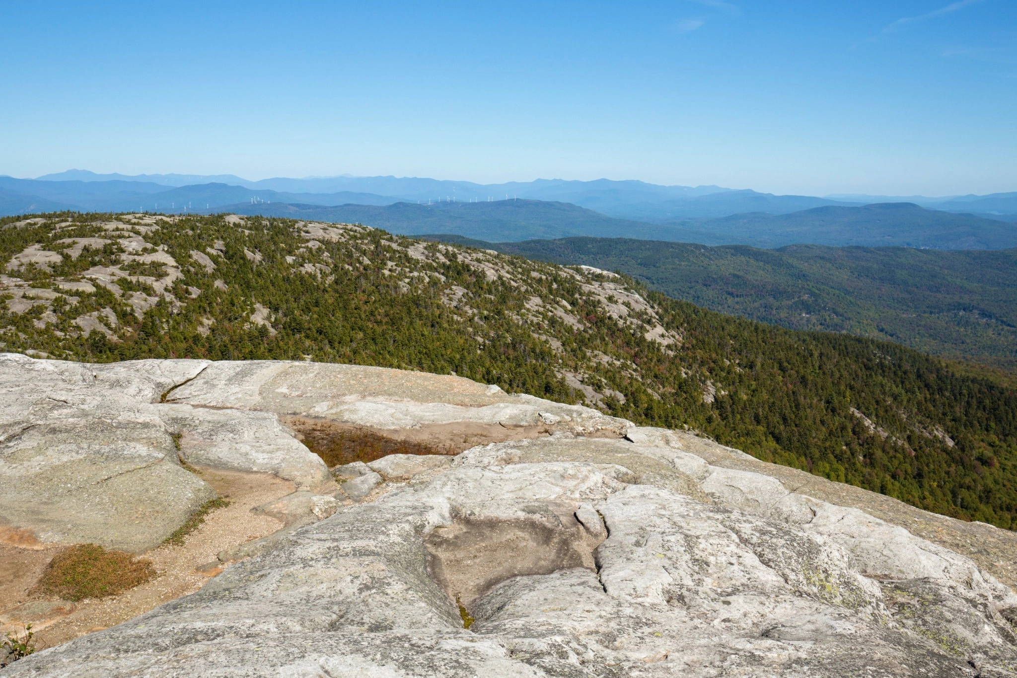 Granite mountains and forest landscape in New Hampshire illustrating how regional geology influences groundwater and drinking water quality
